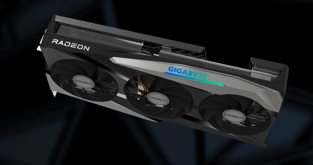 Card đồ họa Gigabyte Radeon RX 6950 XT Gaming OC 16GB có thiết kế mạnh mẽ với ba quạt làm mát lớn màu đen, viền cạnh cứng cáp và các đường nét góc cạnh sắc sảo. Thân card được làm từ kim loại và nhựa chắc chắn, bề mặt nhám giúp chống bám dấu vân tay. Mặt sau là tấm kim loại phẳng, tạo sự vững chắc và hỗ trợ tản nhiệt thụ động. Tổng thể card có kích thước lớn, hình chữ nhật dài, thể hiện phong cách hiện đại, chuyên nghiệp và đậm chất gaming.