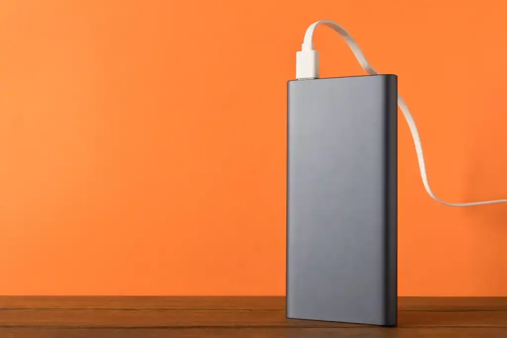 Power-bank-on-desk-plugged-in-and-being-charged